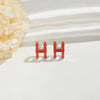 Wholesale Women's Silverplated Copper Oildrip Letter Earrings With Electroplating Process