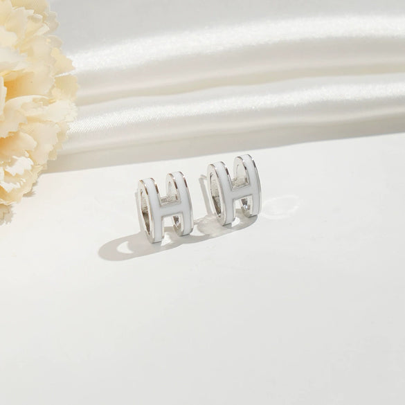 Wholesale Women's Silverplated Copper Oildrip Letter Earrings With Electroplating Process