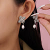 Wholesale Women's Simple Fresh Water Pearl Flower Titanium Steel Earrings With Electroplating Design