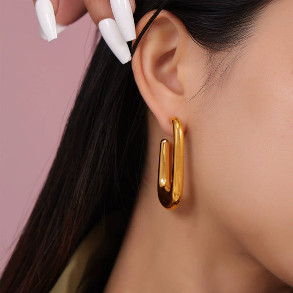 Wholesale Women's Simple Geometric Goldplated Titanium Steel Ushaped Oval Hollow Earrings