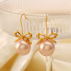 Wholesale Women's Stainless Steel And Pearl Bow Earrings With Electroplating Treatment