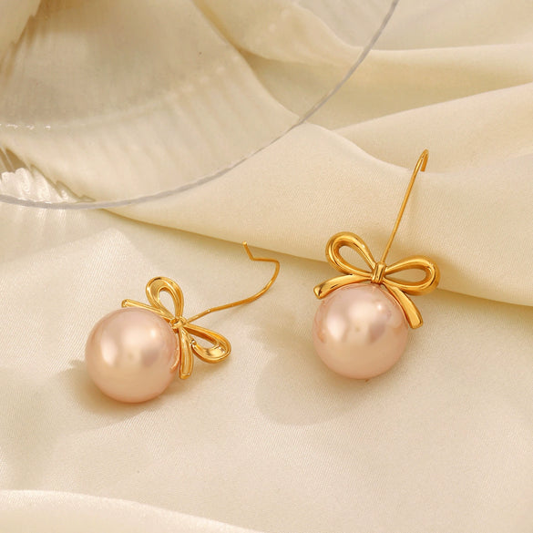 Wholesale Women's Stainless Steel And Pearl Bow Earrings With Electroplating Treatment