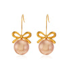 Wholesale Women's Stainless Steel And Pearl Bow Earrings With Electroplating Treatment