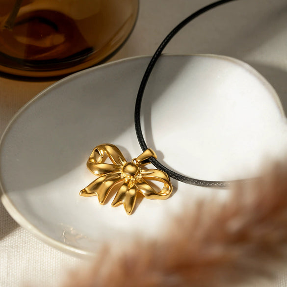 Wholesale Women's Stainless Steel And Titanium Steel Bow Pendant Necklace With Black Wax Rope And Electroplating Design