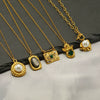 Wholesale Women's Stainless Steel And Titanium Steel Geometric Fashion Goldplated Necklace With Cross Chain