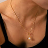 Wholesale Women's Stainless Steel And Titanium Steel Pearl Pendant Necklace With Hollow Water Drop And Geometric Pattern And Electroplating Treatment