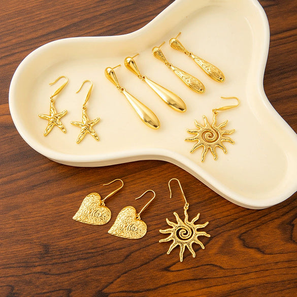 Wholesale Women's Stainless Steel Earrings With Flower Pattern And Electroplating Treatment In Water Drop Shape