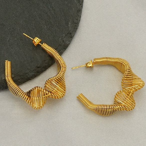 Wholesale Women's Stainless Steel Geometric Hollow Irregular Spring Earrings With Electroplating Treatment