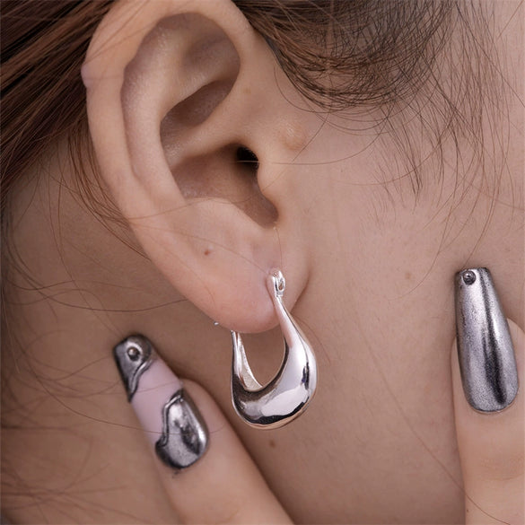 Wholesale Women's Stainless Steel Geometric Ushaped Hollow Exaggerated Simple Silver Glossy Electroplated Earrings