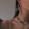 Wholesale Women's Stainless Steel Pearl Diamond Irregular Winding Geometric Style Electroplated Earrings