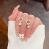 Wholesale Women's Sweet Geometric Copper And 925 Silver Earrings Set With Pearls
