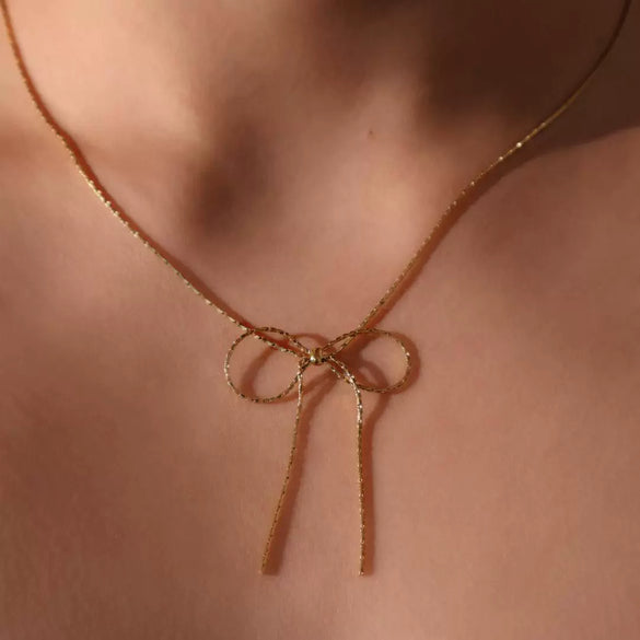 Wholesale Women's Sweet Retro Titanium Steel Bow Necklace With Gold Chain And Electroplating
