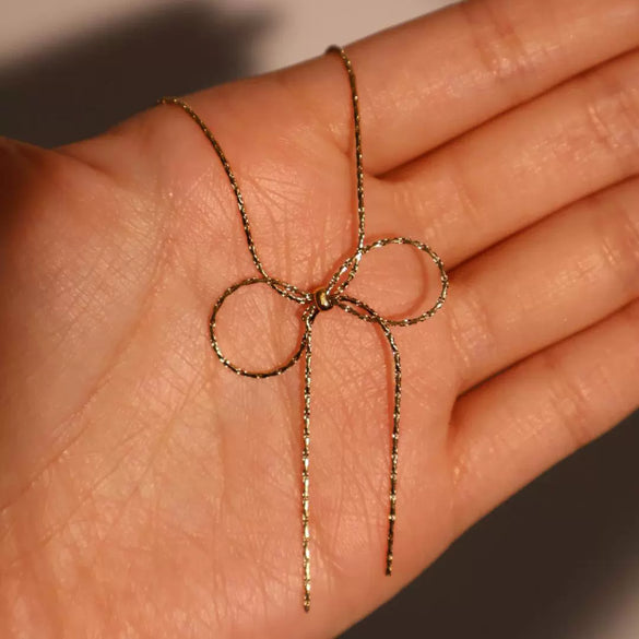 Wholesale Women's Sweet Retro Titanium Steel Bow Necklace With Gold Chain And Electroplating