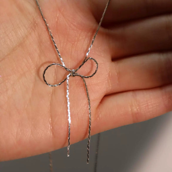 Wholesale Women's Sweet Retro Titanium Steel Bow Necklace With Gold Chain And Electroplating