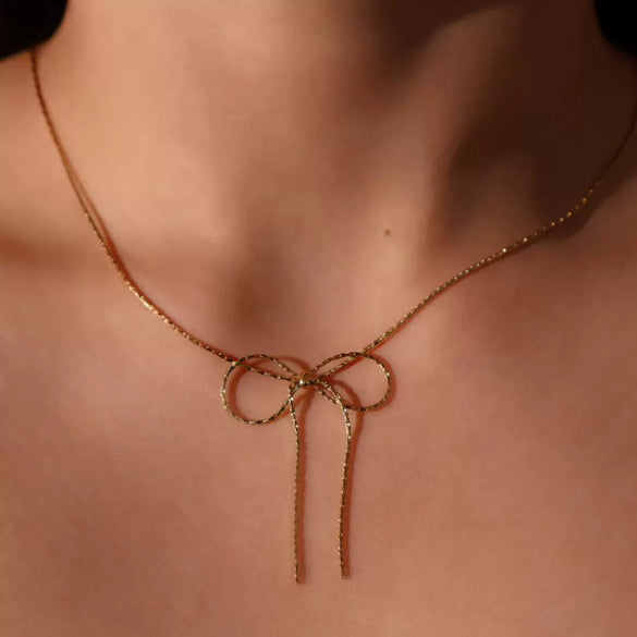Wholesale Women's Sweet Retro Titanium Steel Bow Necklace With Gold Chain And Electroplating