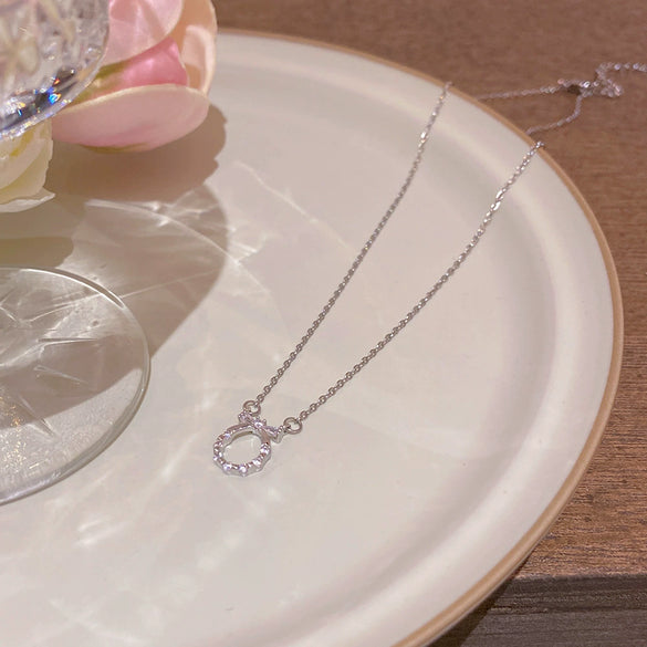 Wholesale Women's Titanium Steel And Copper Necklace With Diamond Design And Cross Chain Style Featuring A Zircon Bow Pendant