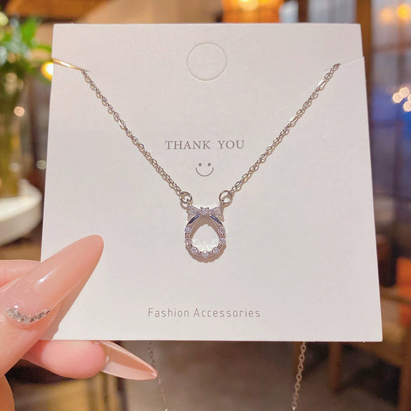 Wholesale Women's Titanium Steel And Copper Necklace With Diamond Design And Cross Chain Style Featuring A Zircon Bow Pendant