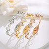 Wholesale Women's Titanium Steel Bracelet With Hollow Four Leaf Flower Design Set With Diamonds