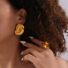 Wholesale Women's Titanium Steel Drop Texture Spiral Asymmetric Color Retaining Earrings With Electroplating
