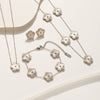 Wholesale Women's Titanium Steel Flower Jewelry Suit With Clover And Plum Blossom Laser Design Electroplated