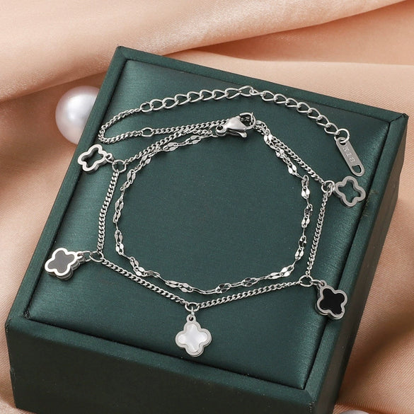 Wholesale Women's Titanium Steel Fourleaf Clover Hollow Inlaid Shell Pendant Bracelet With Geometric Styling And Electroplating Treatment