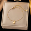 Wholesale Women's Titanium Steel Geometric Drop Shape Real Gold Plated Necklace With Rice Grain Chain Niche Minimalist Sporty Style