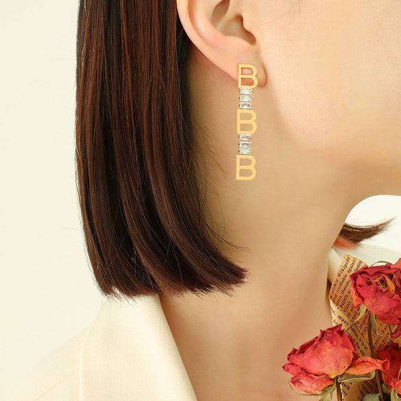 Wholesale Women's Titanium Steel Geometric Irregular Earrings With English Letter Stitching And Zircon Electroplated
