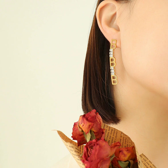 Wholesale Women's Titanium Steel Geometric Irregular Earrings With English Letter Stitching And Zircon Electroplated