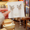 Women's Alloy Bow Star Tassel Earrings With Diamond Design
