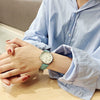 Women's Alloy Case Imitation Leather Strap Round Dial Watch With Printed Logo Retro And Leisure Style