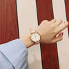 Women's Alloy Case Imitation Leather Strap Round Dial Watch With Printed Logo Retro And Leisure Style