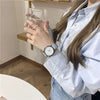 Women's Alloy Case Ordinary Glass Mirror Pointer Quartz Watch With Simple Elegant White Belt And Leisure Style