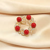 Women's Alloy Flower Red Round Brooch With Electroplating Treatment