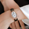 Women's Alloy Leather Gold Clasp Oval Dial Fashion Waterproof Quartz Watch