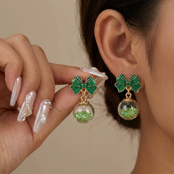 Women's Christmas Bow And Snowflake Bell Dangle Earrings With Transparent Quicksand Ball Design Alloy Electroplated Holiday Jewelry