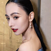 Women's Classical Gold Plated Carved Drop Shape White Stone Earrings With Color Preserving Electroplated Metal Design