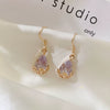 Women's Classical Gold Plated Carved Drop Shape White Stone Earrings With Color Preserving Electroplated Metal Design