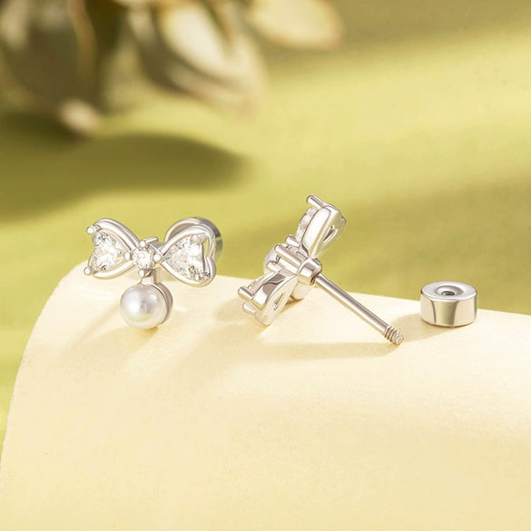Women's Cute Bow Imitation Pearl Titanium Steel Earrings With Electroplating