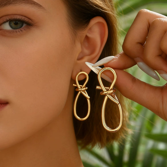 Women's Electroplated Iron Twisted Long Drop Earrings With Geometric Butterfly Knot Design And Stainless Steel Ear Posts