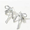 Women's Electroplated Metal Bow Tassel Earrings With Zircon Accents Simple Ribbon Style Artistic Jewelry