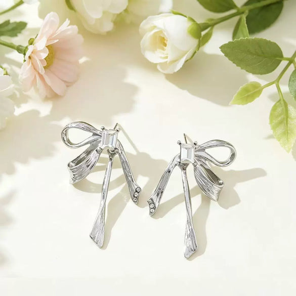 Women's Electroplated Metal Bow Tassel Earrings With Zircon Accents Simple Ribbon Style Artistic Jewelry