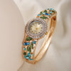 Women's Fashion Alloy Bracelet Quartz Watch With Diamonddecorated Flower And Round Dial