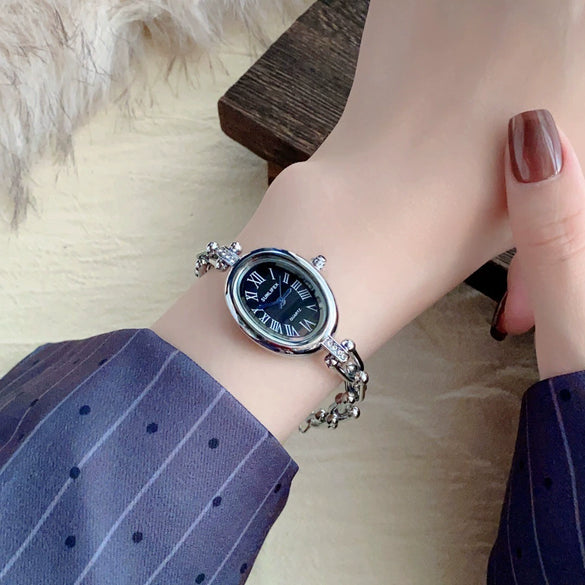 Women's Fashion Alloy Bracelet Watch With Cut Out Design And Roman Numerals