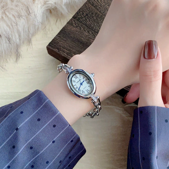 Women's Fashion Alloy Bracelet Watch With Cut Out Design And Roman Numerals