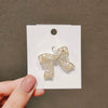 Women's Fashion Light Luxury Alloy Hollow Bow Brooch With Leaves Pattern And Electroplating Treatment