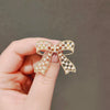 Women's Fashion Light Luxury Alloy Hollow Bow Brooch With Leaves Pattern And Electroplating Treatment