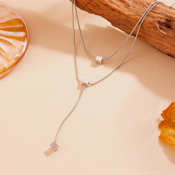 Women's Fashion Stainless Steel And Titanium Steel Neck Chain With Geometric Pattern Steel Ball And Square Tassel Design