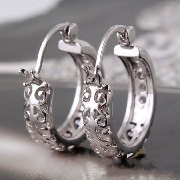 Women's Geometric Diamond Earrings In Electroplated Alloy With A Curved Statement Design For Fashion Jewelry Collections
