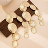Women's Geometric Oval Metal Long Tassel Earrings With Electroplated Irregular Design And Stainless Steel Ear Needles