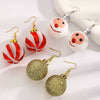 Women's Geometric Round Ball Drop Earrings With Glittery Gold And Red Design Steel Ear Hooks For Festive Parties